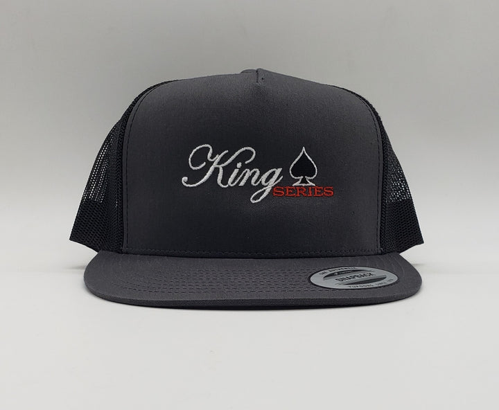 King Series 6 Door Pickup Truck Flat Bill Trucker Cap 65/35 polyester/cotton Multicam is 60/39/1 cotton/polyester/spandex Structured, five-panel, high-profile, 3 1/2" crown Flat bill, matching undervisor  Multicam undervisor is black Alpine undervisor is white Snapback closure